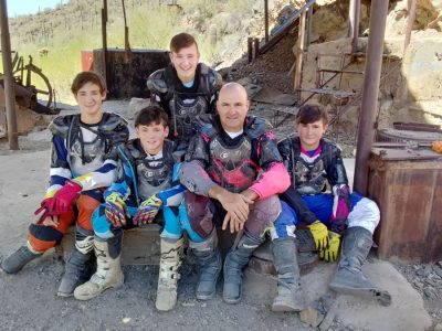 Doug with young riders in gear after a ride